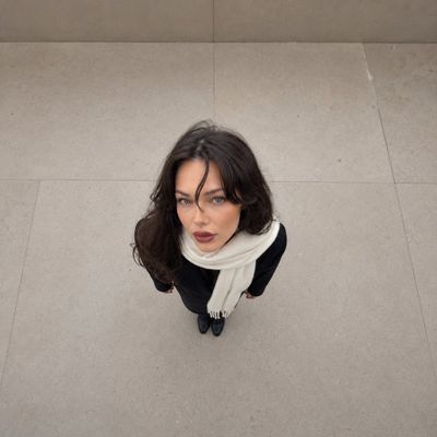 Overhead forced-perspective portrait shows giant head on tiny body