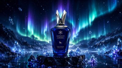A sapphire perfume bottle glows beneath vibrant Northern Lights.