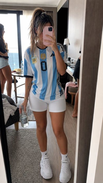 Young woman in Argentina jersey captures a candid mirror selfie