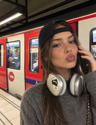 Candid smartphone photo swaps a woman's face while keeping outfit intact