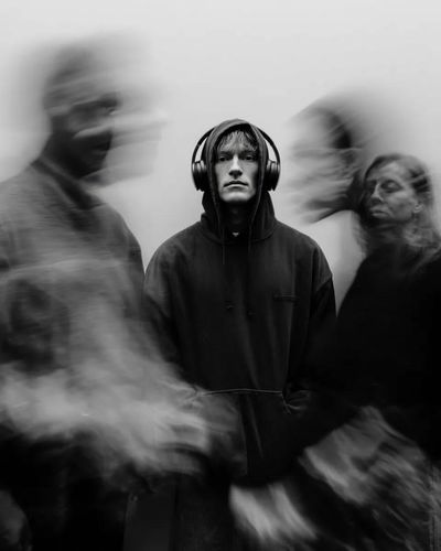 Stillness Amidst Motion: A Cinematic Black and White Portrait