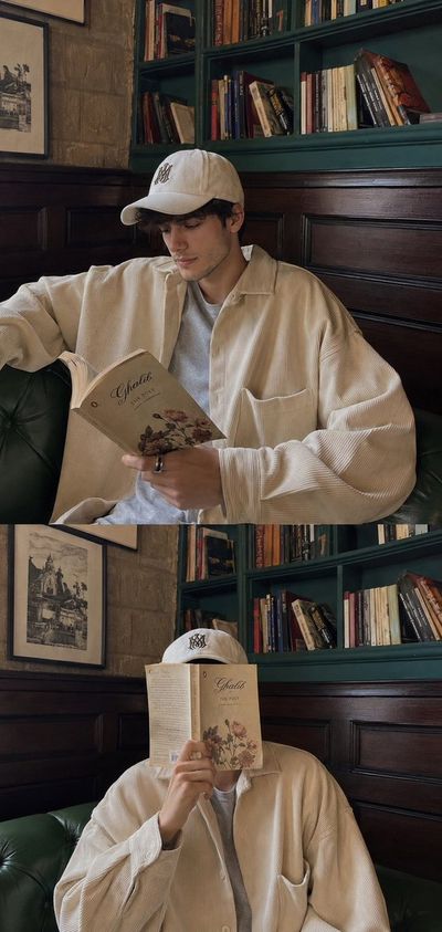 A young man reads poetry in a cozy teal-green cafe