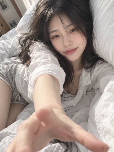 Morning Light Girlfriend Reaches Out From Cozy White Bed Sheets