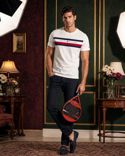 Athletic male model poses in preppy Tommy Hilfiger style