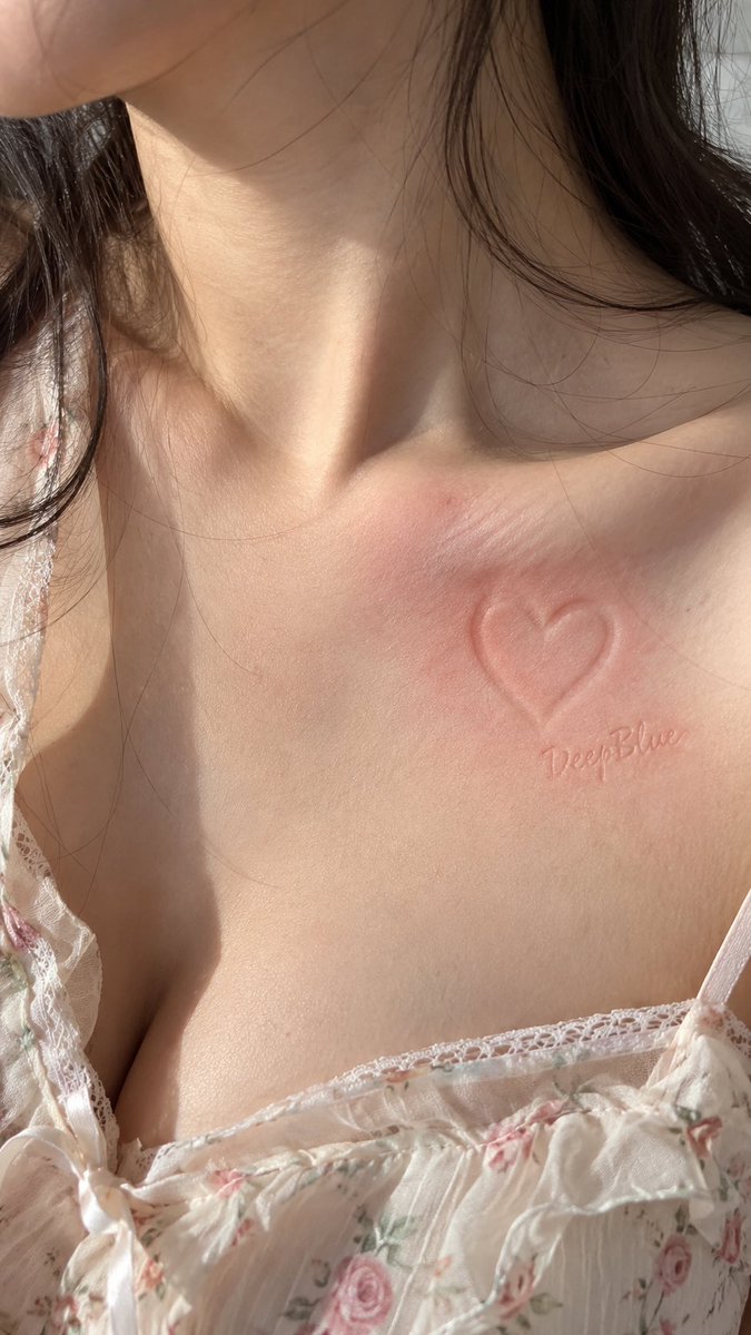 Heart-Shaped Press Mark Blushes on Delicate Collarbone Skin