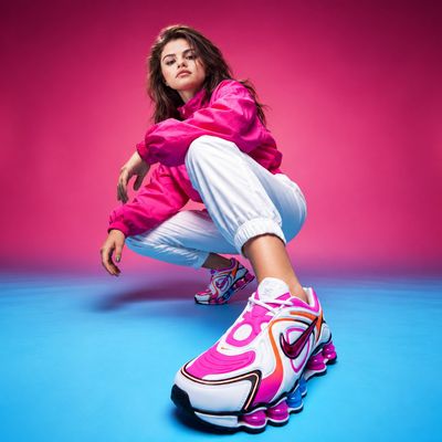 Selena Gomez crouches in pink windbreaker for futuristic sneaker campaign