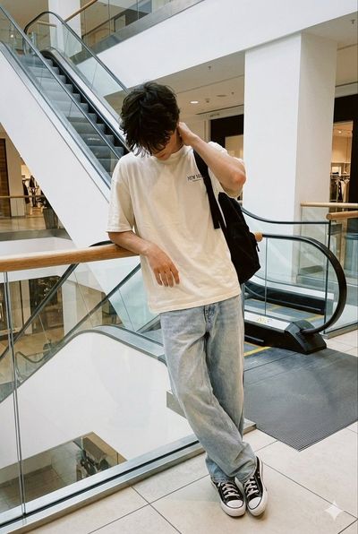 Casual Elegance: A Candid Moment at the Mall