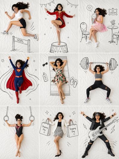 Young woman leaps over a hand-drawn doodle hurdle in sporty action