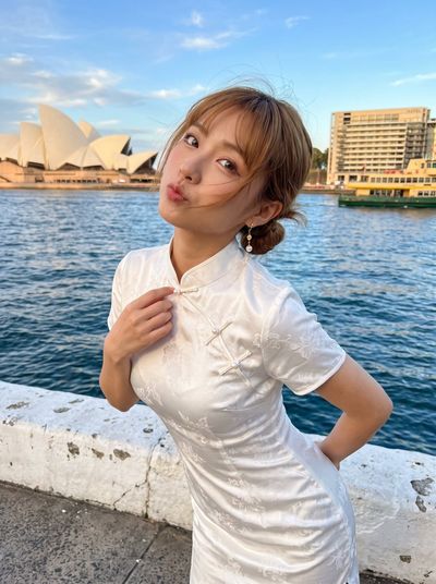 East Asian Woman in Qipao Posing at Sydney Harbour Golden Hour