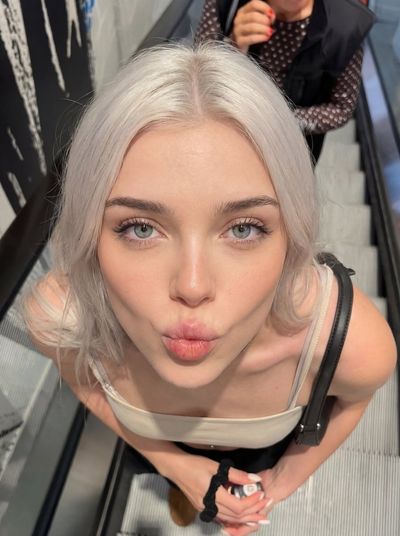 Urban Vibes: Playful Escalator Selfie