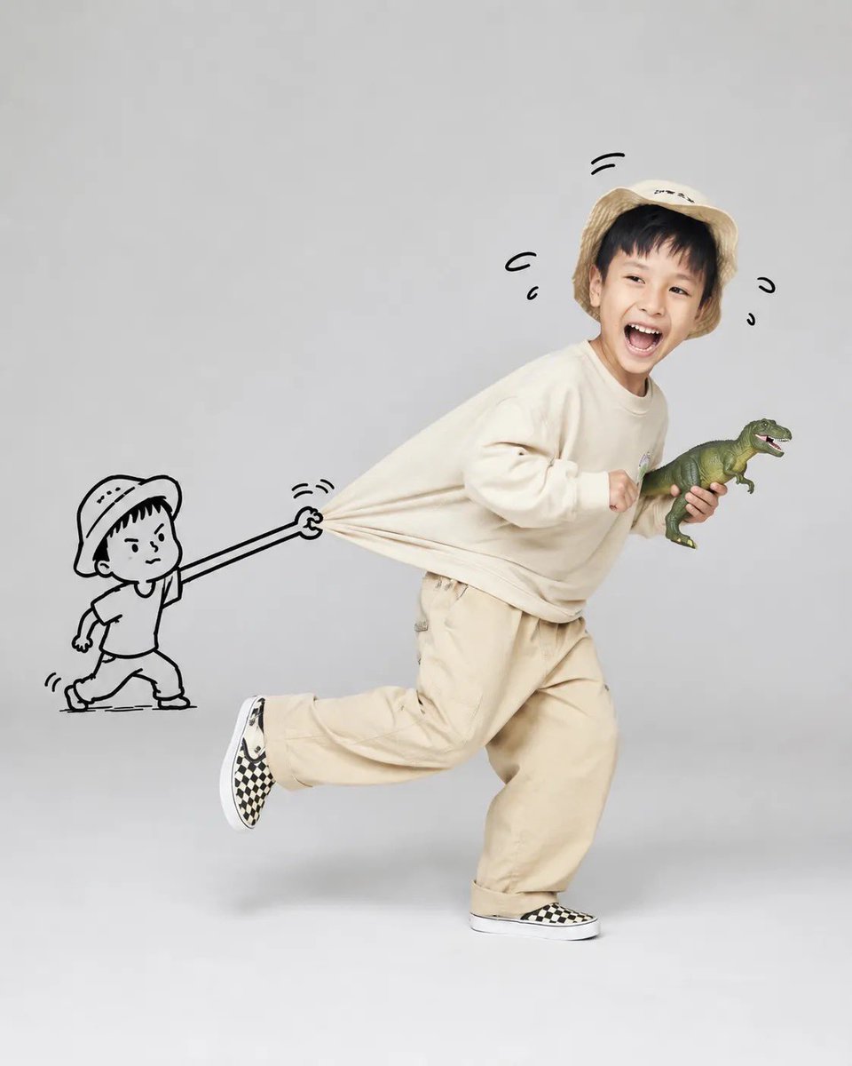 A joyful child runs while a cartoon figure pulls their shirt.