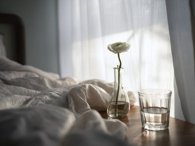 Tranquil Dawn: Product on Bedside Table in Soft Morning Light