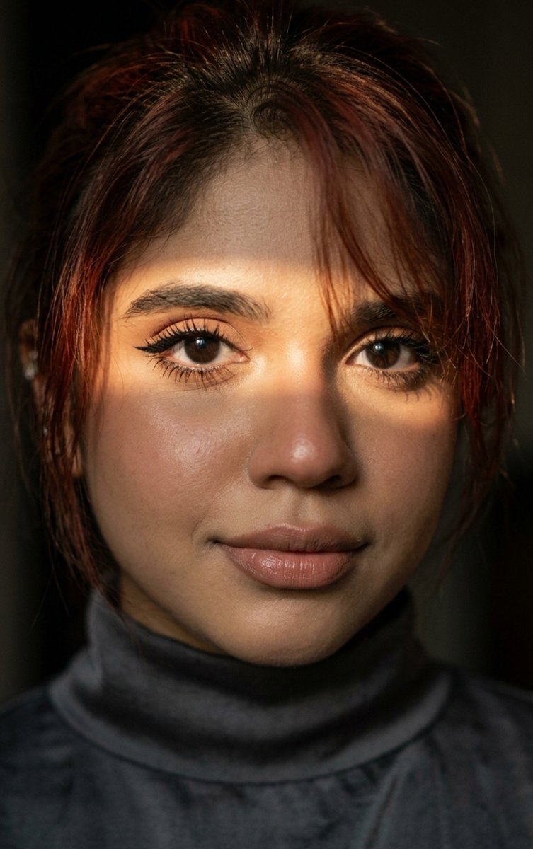Close-up portrait of a woman's face in warm directional light