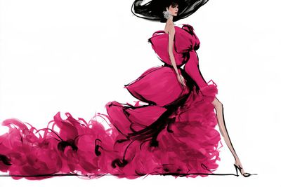 Elegant model in couture gown strikes a dramatic runway pose