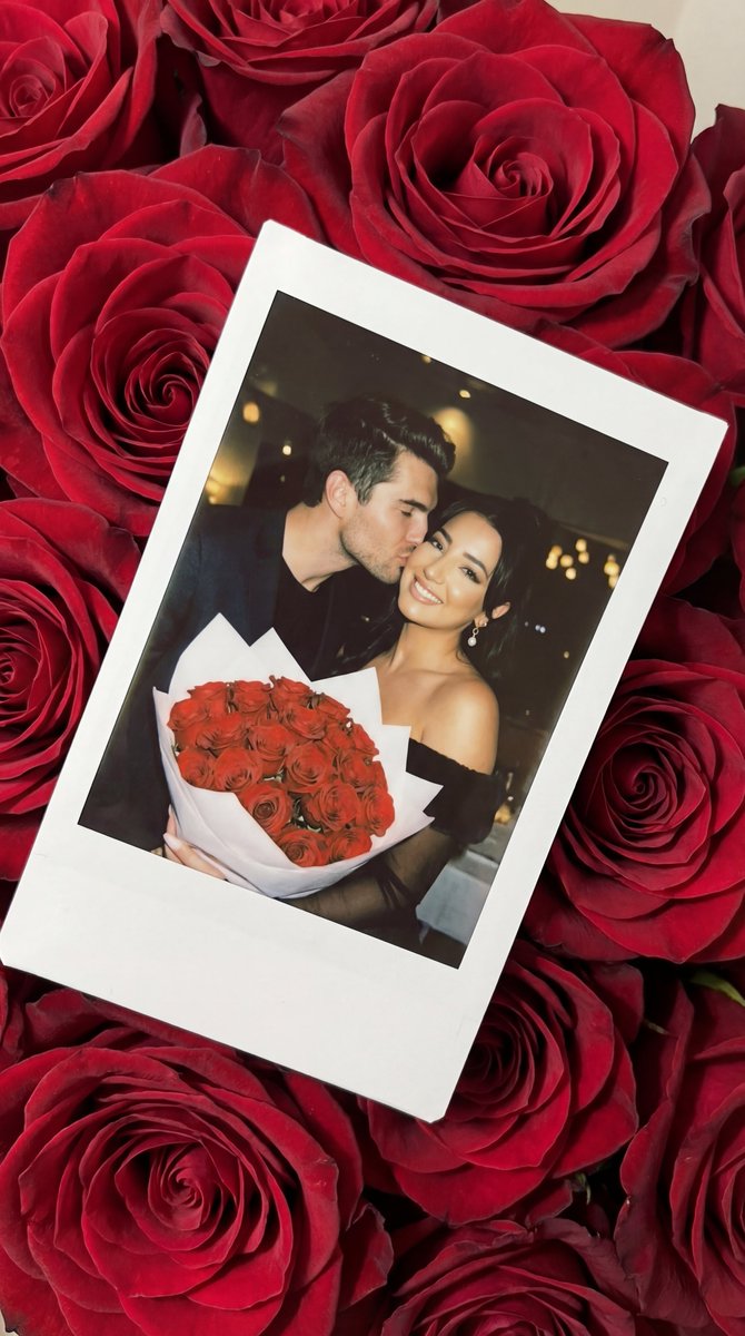 Kiss of Romance Amidst Red Roses