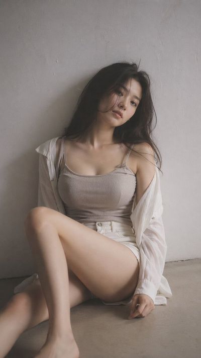 Muted Elegance: Quiet Portrait of a Young Woman