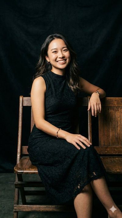Elegant woman smiles warmly on vintage wooden bench