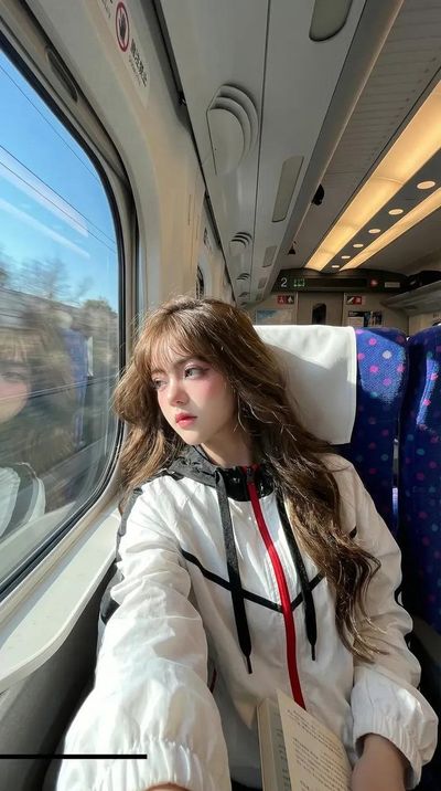 Windblown Train Ride: A Handsome Traveler's Candid Selfie