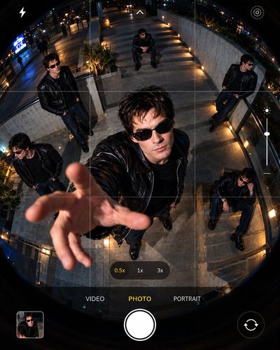 Fisheye Phone View Captures Multiple Identical Figures in Urban Scene