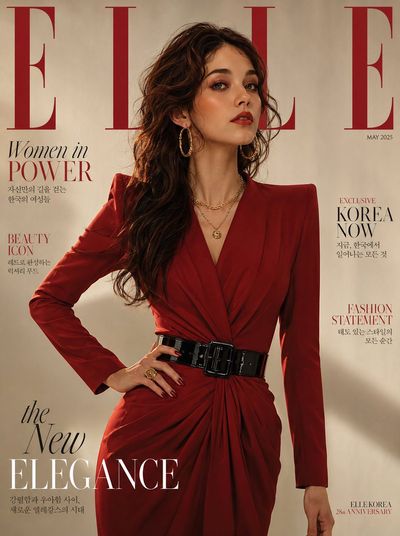 A Korean woman in red power dress commands the cover
