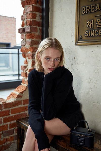 Freckled Muse in a Rustic Café Portrait