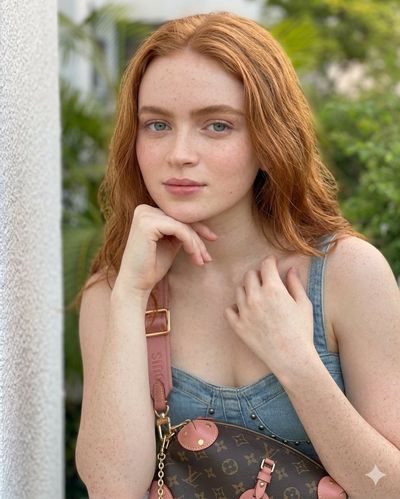 Sunlit Portrait of a Freckled Redhead in Denim and Cargo Pants