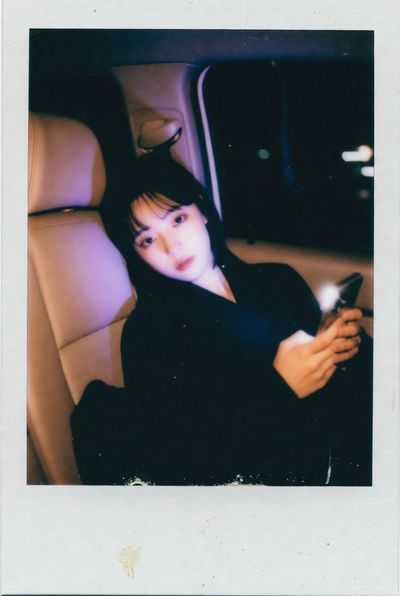 Melancholy Glow: K-Pop Star in Vintage Polaroid Light