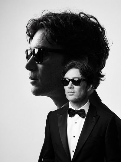 Pedro Pascal in Monochrome Double-Exposure Tuxedo Portrait, Brooding Gaze