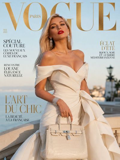 French elegance shines in sculptural ivory gown under golden light