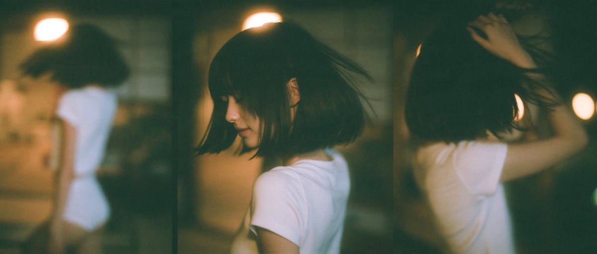 Japanese woman in washitsu room with side profile and hand sweeping bangs