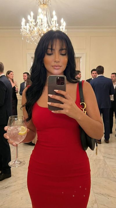 Elegant Mirror Selfie in Golden Party Glow
