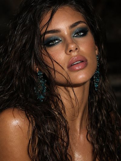 Hyper-realistic portrait of girl with wet wavy hair and smoky eyes