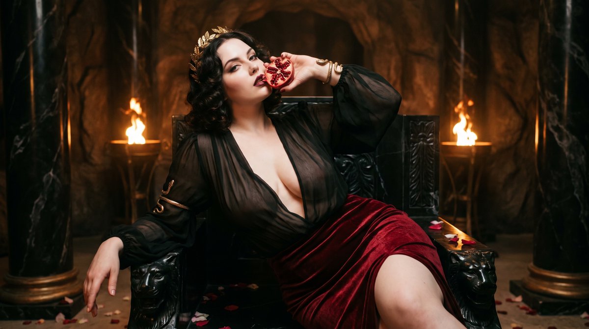 Persephone Reclines on Obsidian Throne Holding Pomegranate in Underworld