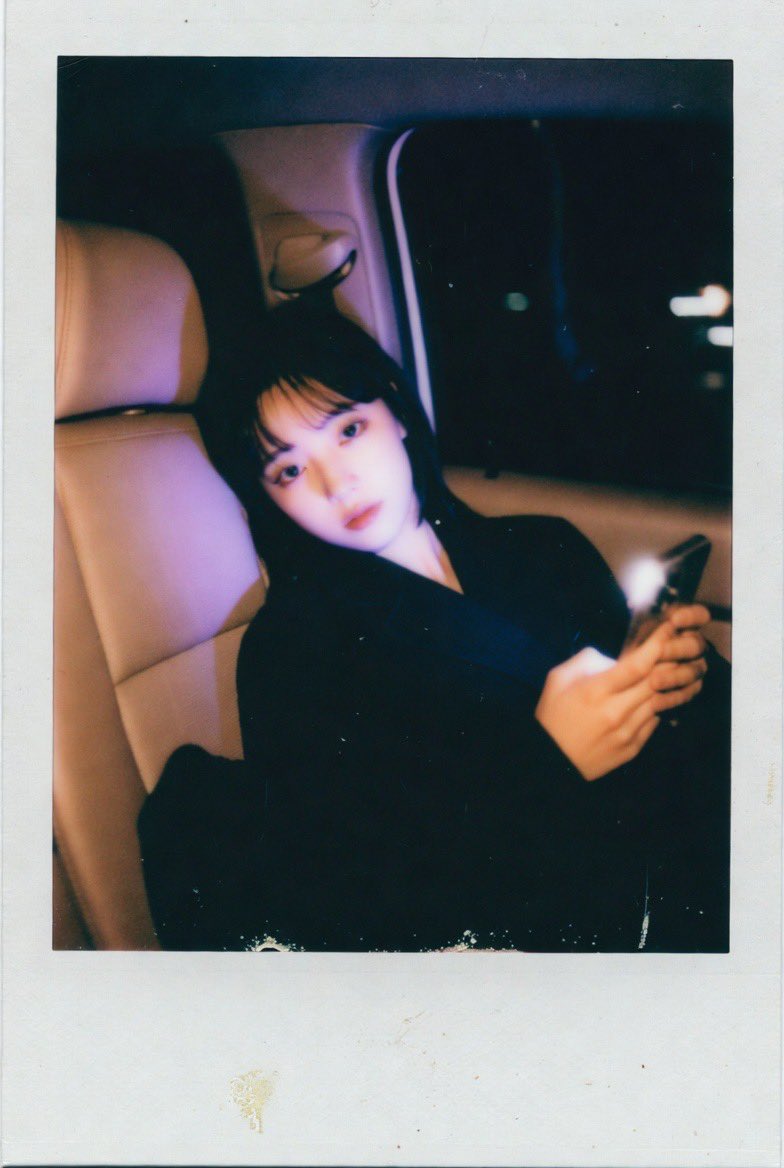 Melancholy Glow: K-Pop Star in Vintage Polaroid Light