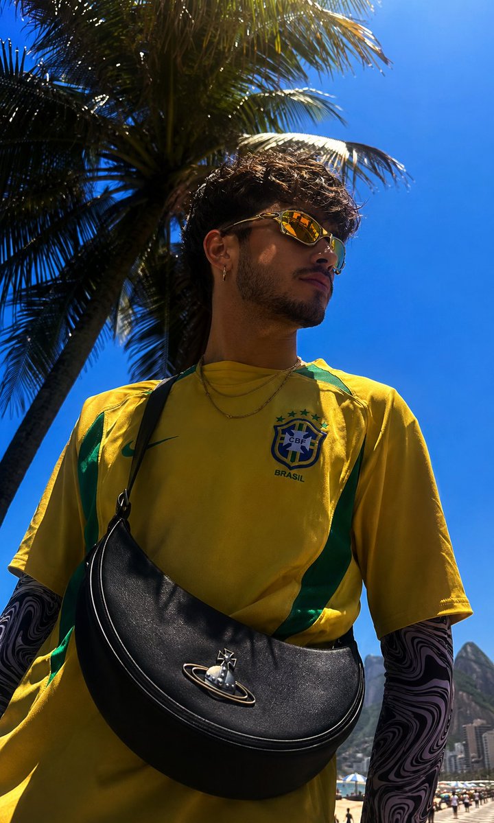 A vintage Brazil jersey glows under harsh midday tropical sunlight.