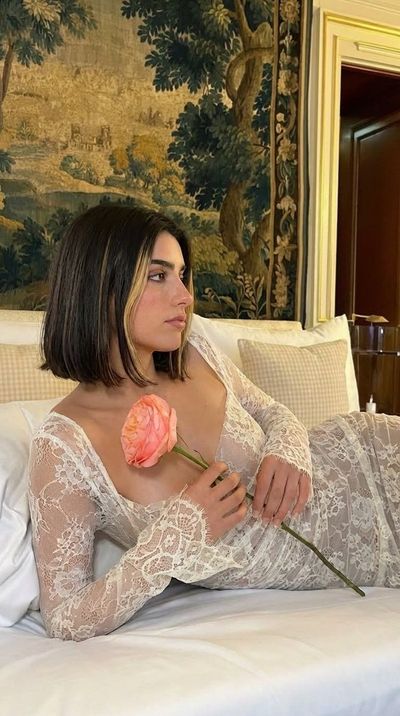 Ethereal Portrait of a Young Woman in Ivory Lace with Garden Rose