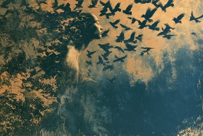 Surreal sgraffito vision reveals dreamlike figures etched in vivid layers