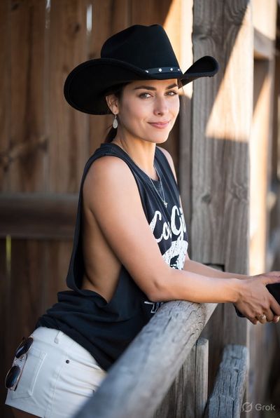 Golden Hour Cowgirl Portrait in Rustic Farm Setting