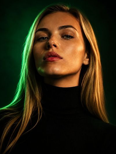 Emerald glow transforms this portrait into a cinematic fashion cover