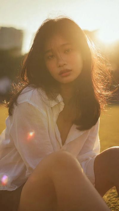 Golden Hour Serenity: Cinematic Portrait with Warm Halo Light