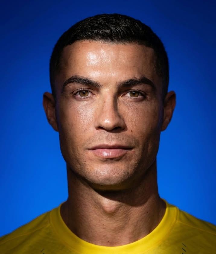 Close-up portrait with dramatic studio lighting and shadow