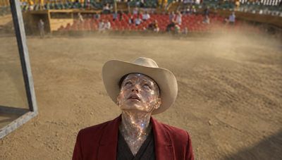 Crystalline Rodeo Performer Gazes Skyward in Dusty Arena