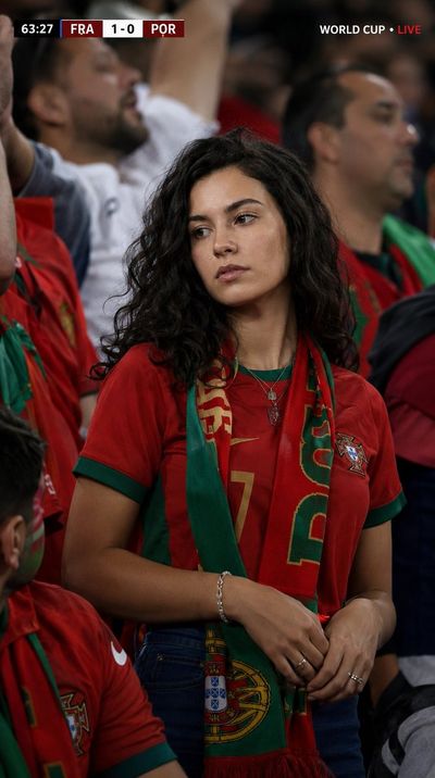 Portugal fan cheers intensely during World Cup match in stadium