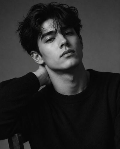 A young man's intense gaze defines this moody portrait.