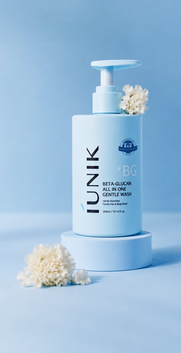 A single baby-blue pump bottle stands on a pedestal with flowers