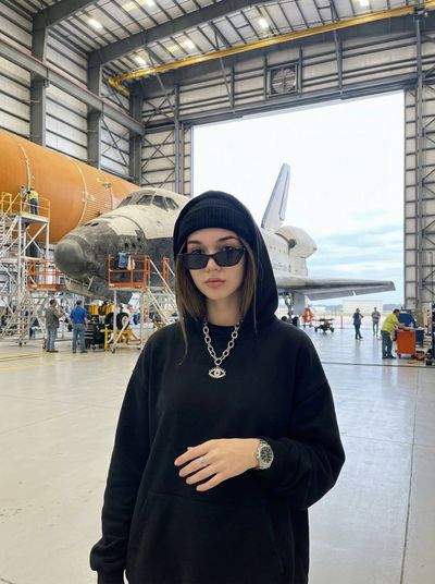 Bold Confidence in a Futuristic Hangar