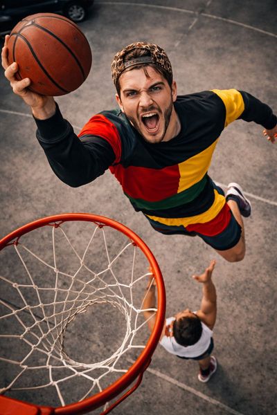 High-Flying Slam Dunk Over Defender