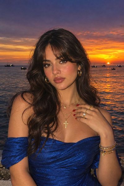 Woman in Blue Gown Poses at Golden Hour Tide