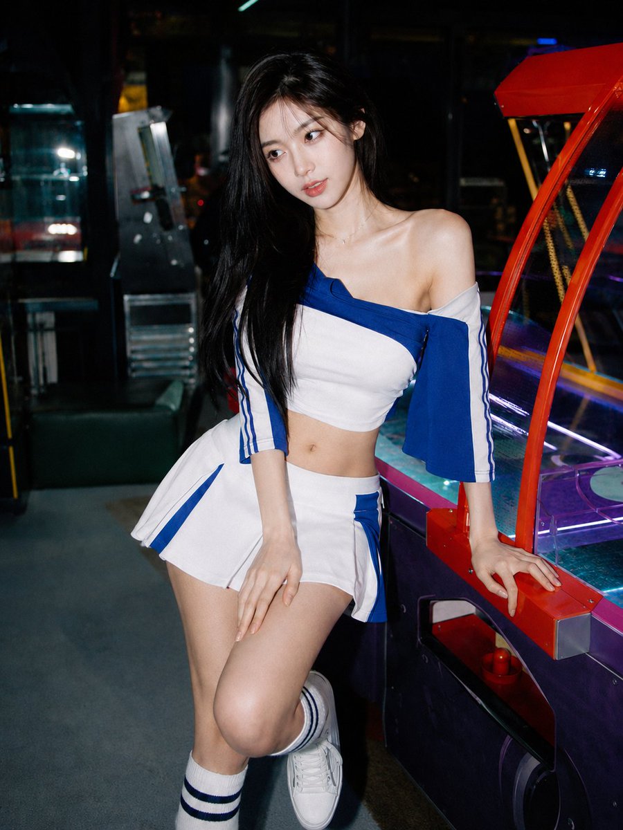 Neon arcade flash freezes a Korean girl in quiet thought