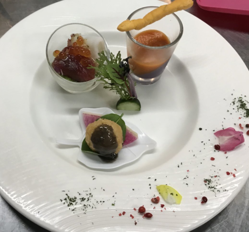 Golden croquette with rich sauce and fresh seafood garnishes